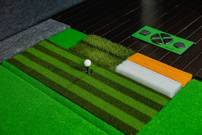 A variety of Golfzon’s hitting mats for a golf simulator setup.